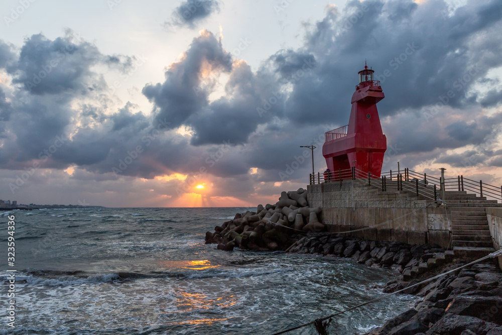 Obraz premium Iho Lighthouse at Iho Tewoo beach in the North of Jeju, South Korea