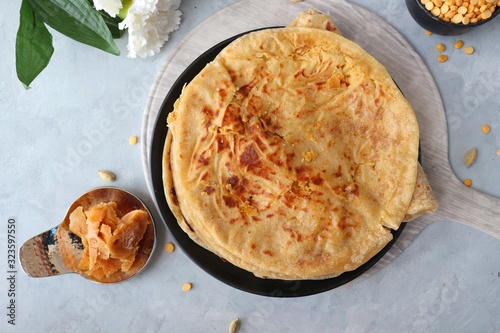 Canvas Print Holi Festival Food - Puran Poli is an Indian sweet flatbread stuffed with mixture of chana dal, jaggery, ghee & cardamom