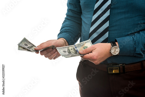 business man in suit holding us dollar bills, isolated on white