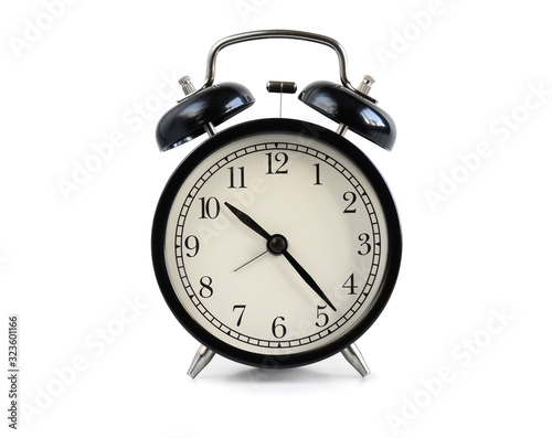 Black old fashioned alarm clock isolated on white background