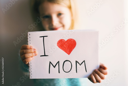 I love mom. 8 march. Girl with handmade card