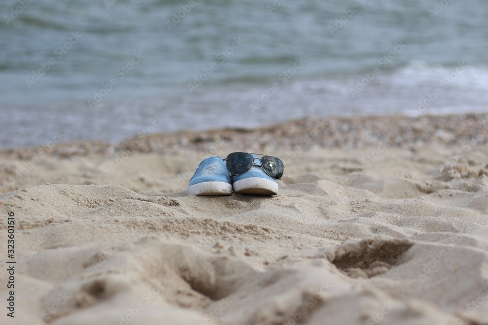 Obraz premium the sneakers on the beach