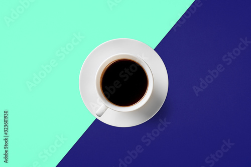  cup of coffee on a background of Phantom Blue and Aqua Menthe color