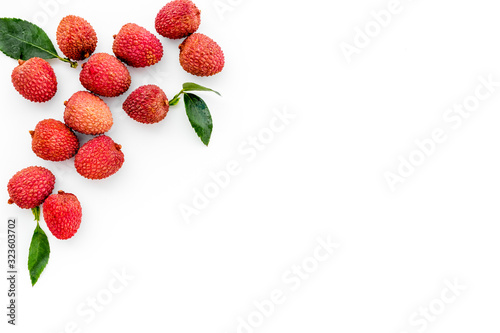 Fototapeta Naklejka Na Ścianę i Meble -  Lychee frame. Fresh juicy fruits on white background top-down copy space