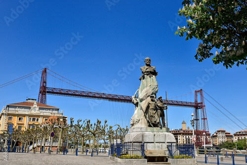 Victor de Chávarri Statue and Biscay Bridge in the background, Portugalete, Biscay, Basque Country, Euskadi, Spain, Europe photo