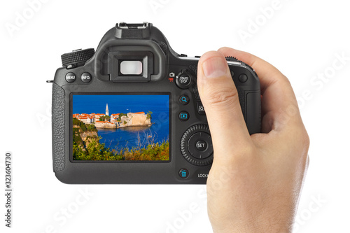 Hand with camera and Budva Montenegro image (my photo)