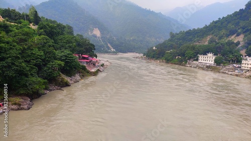 View of the Gangaes with trees, sand and blue sky Shivpuri Rishikesh photo
