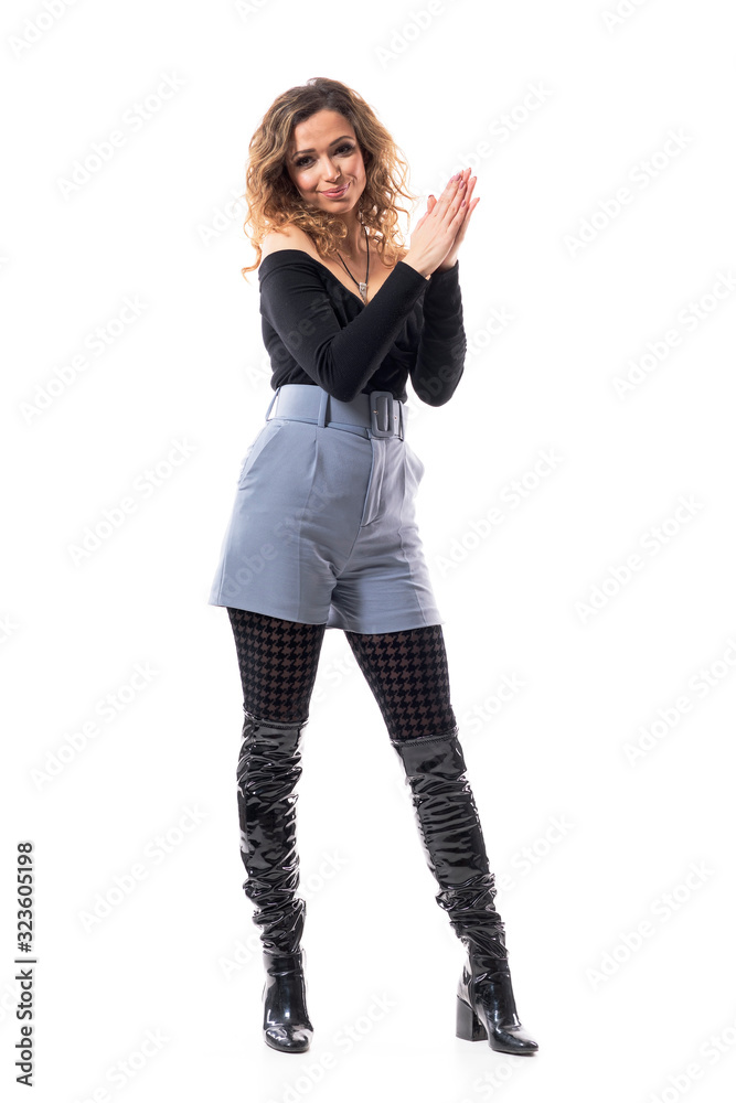 Young pretty curly hair brunette woman applauding endorsing and congratulating clapping hands. Full body isolated on white background. Young pretty curly hair brunette woman applauding endorsing and congratulating clapping hands. Full body isolated on white background.
