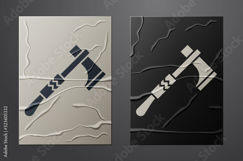 White Native american tomahawk axe icon isolated on crumpled paper background. Paper art style. Vector Illustration
