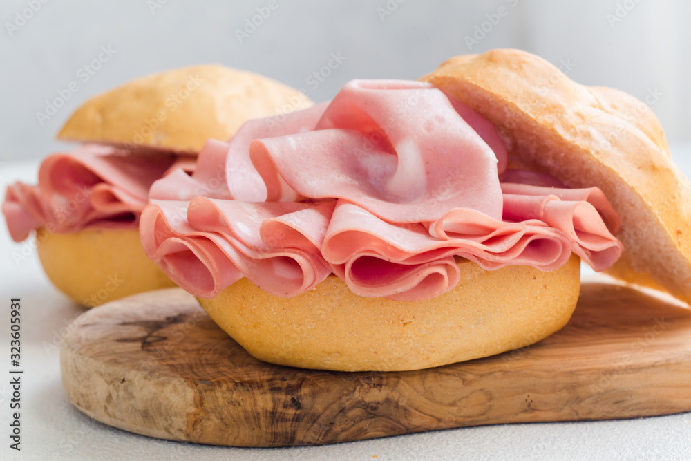 Sandwich with mortadella. Sliced mortadella from Bologna a large italian sausage or luncheon