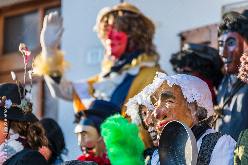 Obraz premium Ancient carnival of Sauris. Traditional wooden masks. Italy