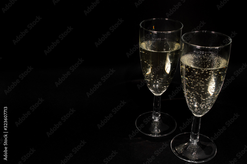 Champagne glass on black background Champagne glass on black background