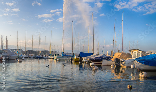 Beautiful View of historic Geneva skyline with famous Jet d'Eau fountain at harbor district in beautiful of Geneva, Switzerland