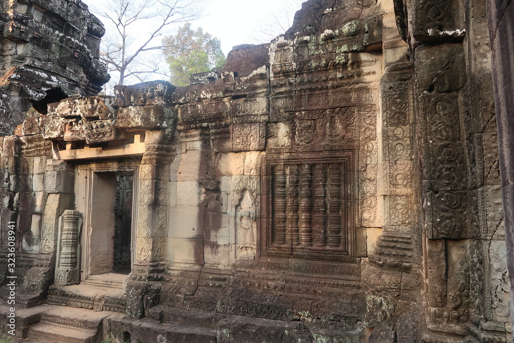 temple ruins with door in unesco world heritage site angkor wat, cambodia with shiva and vishnu hindu symobls