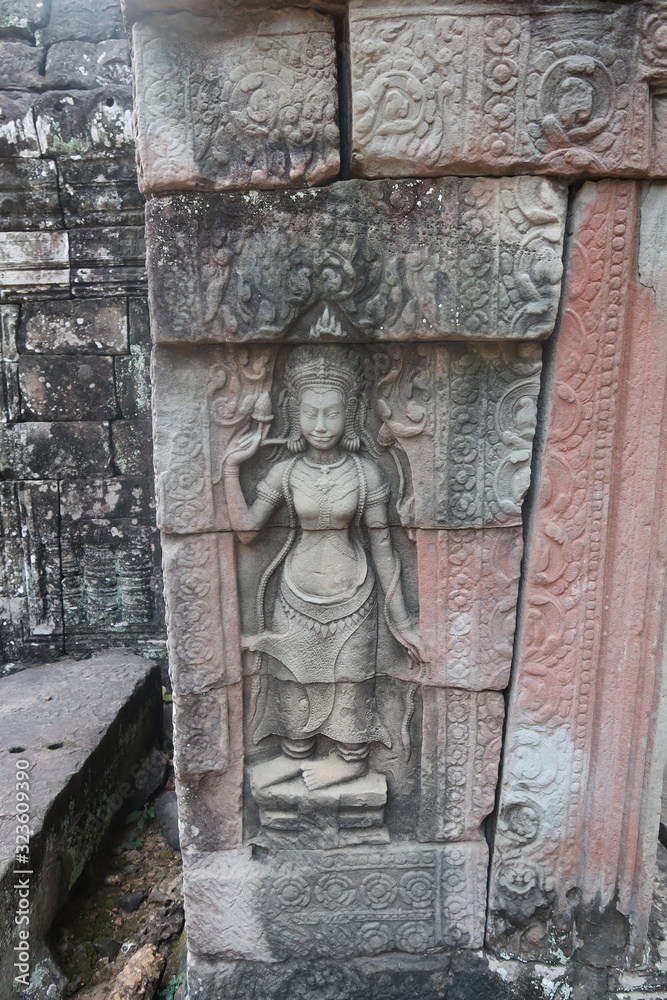 vishnu, shiva, hindu god symbol, face in ancient temple ruins of angkor wat, cambodia, yoga class