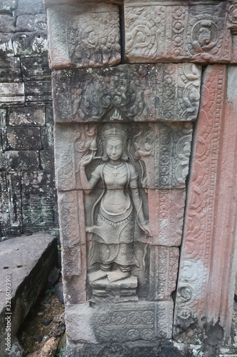 vishnu, shiva, hindu god symbol, face in ancient temple ruins of angkor wat, cambodia, yoga class