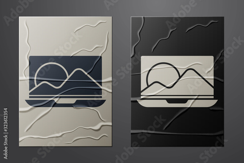 White Laptop icon isolated on crumpled paper background. Computer notebook with empty screen sign. Paper art style. Vector Illustration