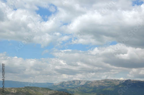 Beautiful clouds on a blue sky in the mountains. Crimean mountains