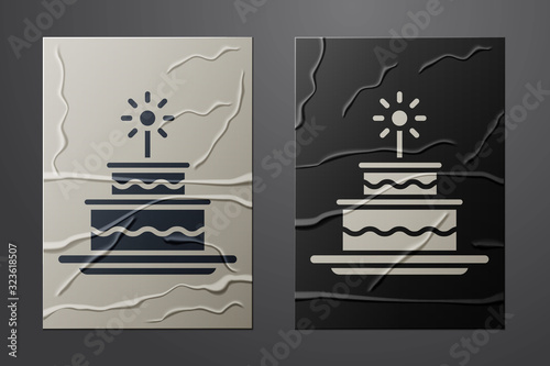 White Cake with burning candles icon isolated on crumpled paper background. Happy Birthday. Paper art style. Vector Illustration