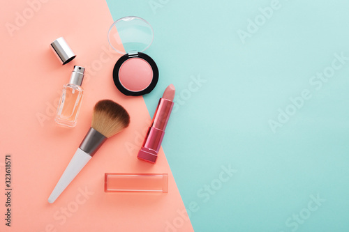 Cosmetic beauty products on pastel color background