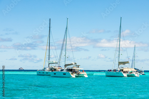 Turquoise colored sea with ancored catamarans, Tobago Cays, Saint Vincent and the Grenadines, Caribbean sea © vadim.nefedov