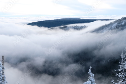 Fog on snow mountains