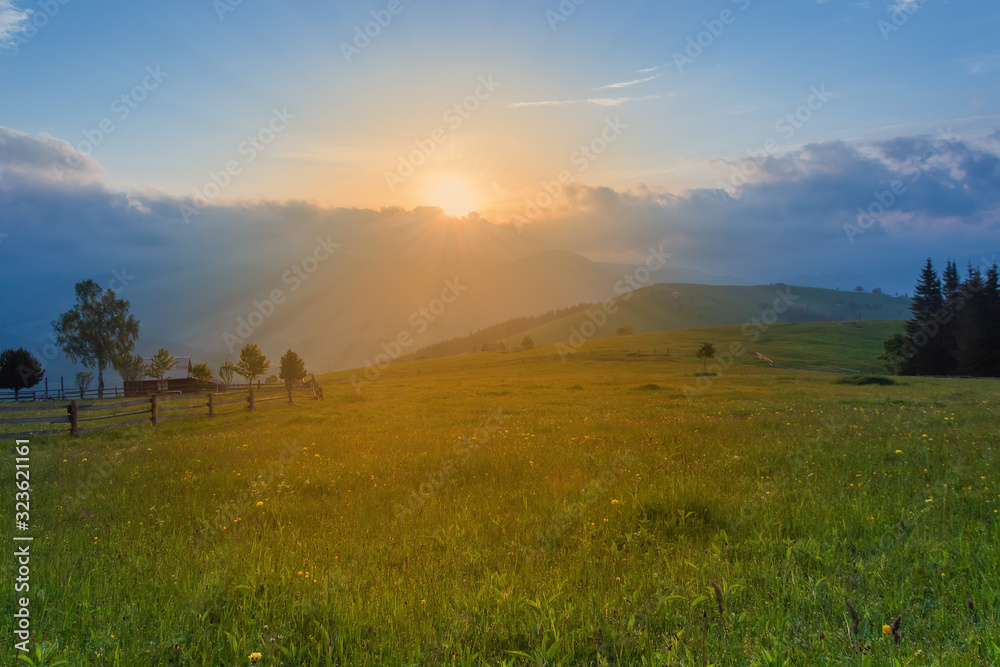 Sunrise on a highland glade in the Carpathian Mountains