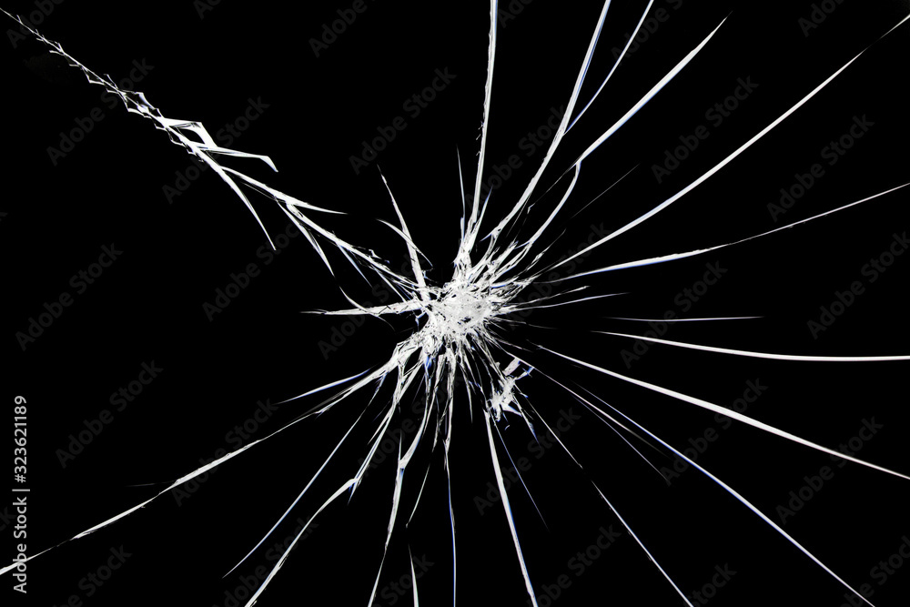 Obraz premium Cracks on broken glass. Abstraction pattern on the window.