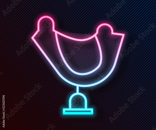 Glowing neon line Wild west saddle icon isolated on black background. Vector Illustration
