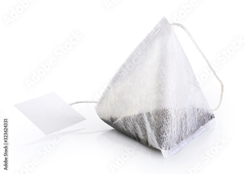 Tea bag with white label isolated on white background. photo
