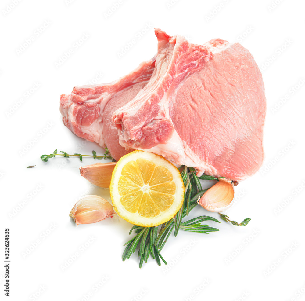 Raw pork meat with spices on white background Raw pork meat with spices on white background