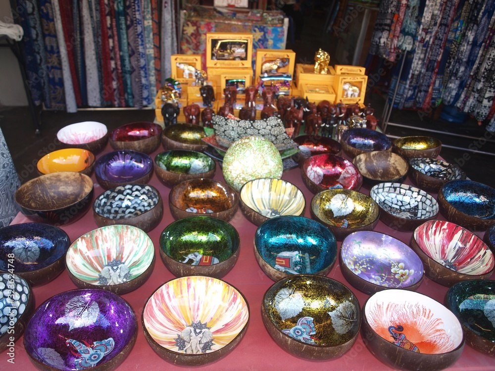 Asian market. Gift shop in thailand. Top view on the counter. Traditional Asian handmade souvenirs and figurines on sale for tourists. Tourist and trade small business.