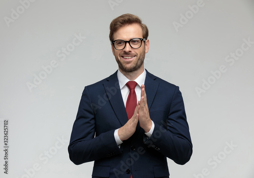 Quadro em tela businessman standing and rubbing hands happy