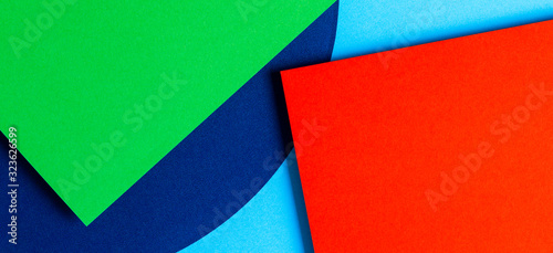 Abstract colored paper texture background. Minimal geometric shapes and lines in red, light blue, navy, green colors