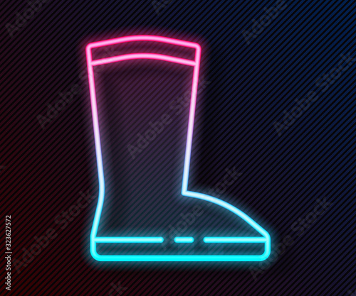 Glowing neon line Waterproof rubber boot icon isolated on black background. Gumboots for rainy weather, fishing, gardening. Vector Illustration