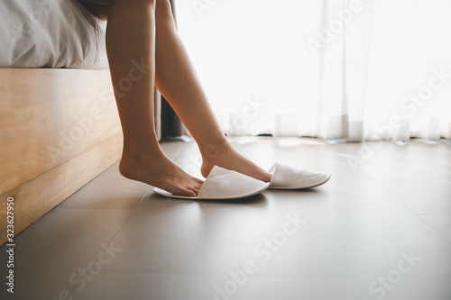 woman legs with slippers photo