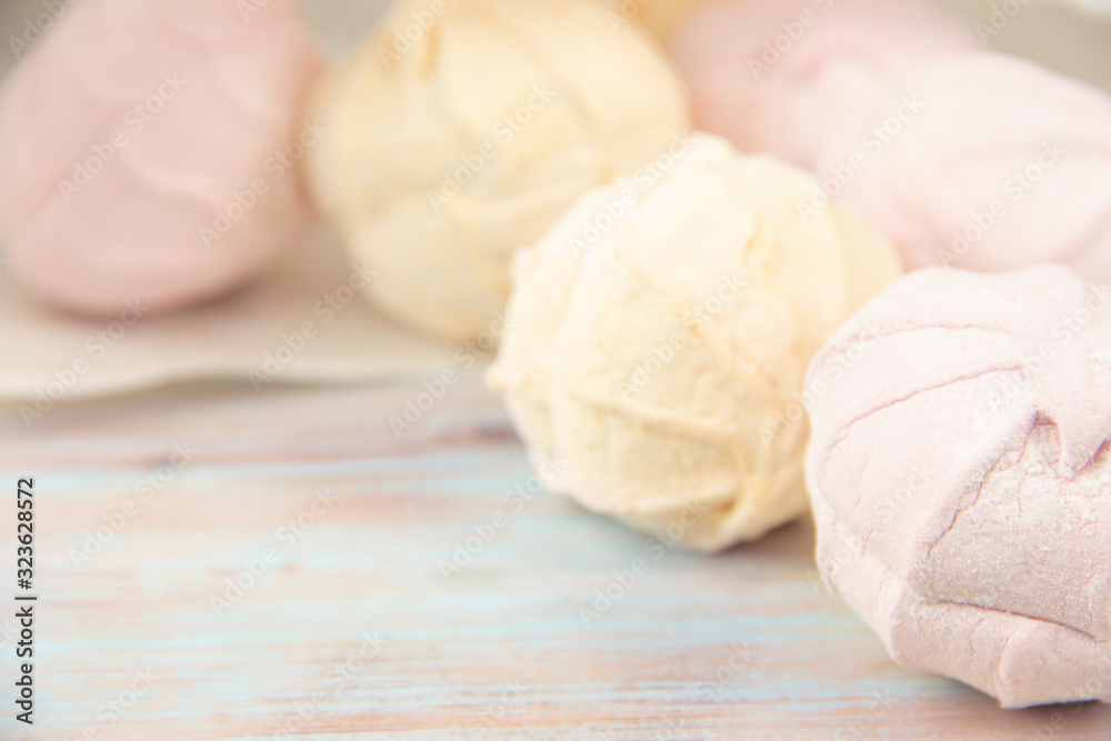 Multicolored air marshmallows in pastel shades, marshmallows in a light key. Multicolored air marshmallows in pastel shades, marshmallows in a light key.