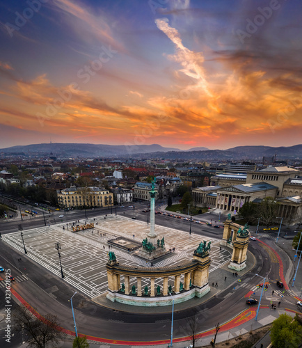 Budapest, Hungary - Aerial drone view of beautiful Heroes' Square and Millennium Monument with Museum of Fine Arts and a beautiful golden sunset sky