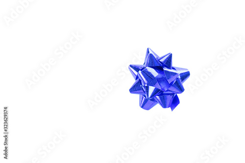 Voluminous blue gift festive bow on white background with copy space
