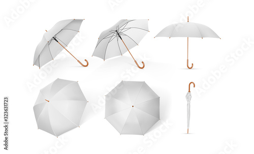 collection of white umbrellas with wooden handle isolated on a white background  mock up