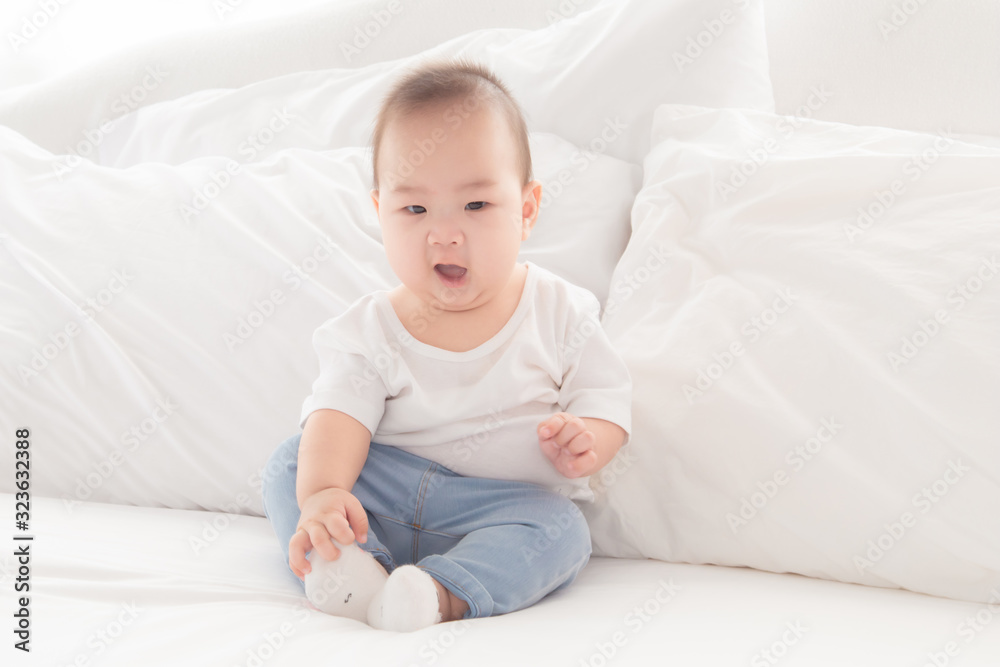 Asian cute adorable baby healthy boy good mood smiling laughing lie down on bedroom upturn playing with camera or mother, baby toddler, infant childhood soft skin happy face expression looking mom Asian cute adorable baby healthy boy good mood smiling laughing lie down on bedroom upturn playing with camera or mother, baby toddler, infant childhood soft skin happy face expression looking mom