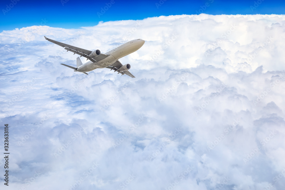 Airplane flying at high altitude and beautiful high-altitude clouds in spring Airplane flying at high altitude and beautiful high-altitude clouds in spring