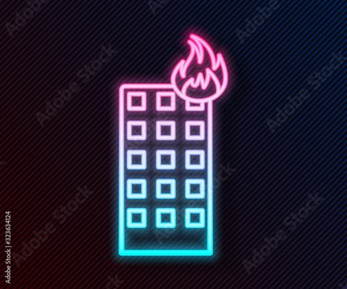 Glowing neon line Fire in burning building on city street icon isolated on black background. Vector Illustration