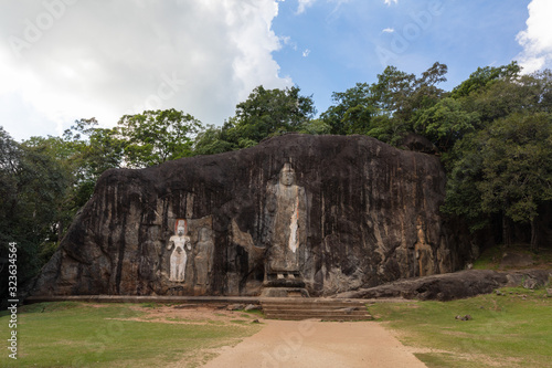 Buduruwagala temple with well preserved carvings on the wall in Wellawaya Sri Lanka. Buddha statue. photo