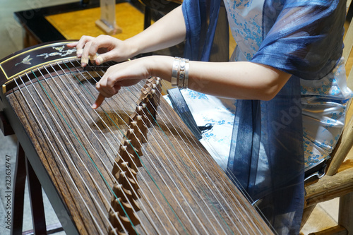 Women are playing zither, Chinese instruments