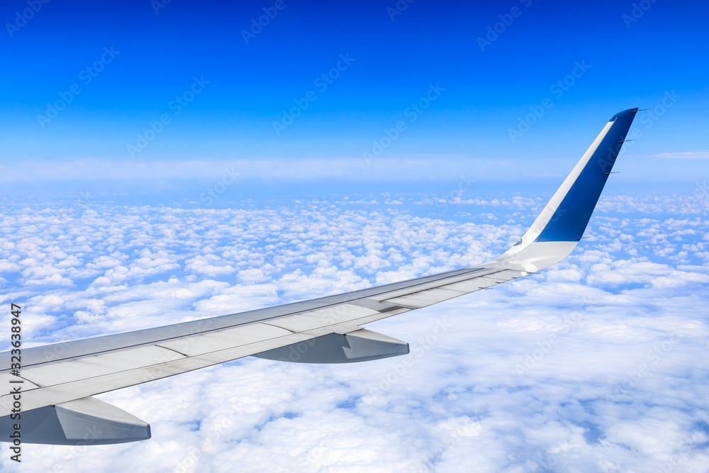 Airplane flying at high altitude and beautiful high-altitude clouds in spring Airplane flying at high altitude and beautiful high-altitude clouds in spring