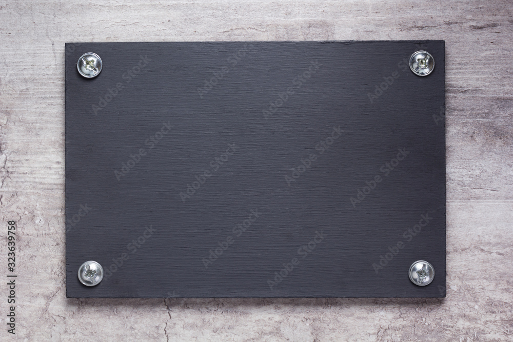 wooden nameplate or wall sign at concrete background wooden nameplate or wall sign at concrete background