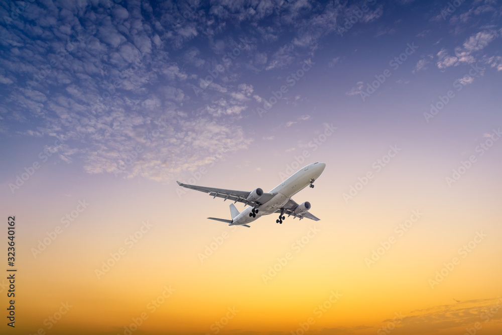 High-altitude airplane and beautiful sky at dusk High-altitude airplane and beautiful sky at dusk