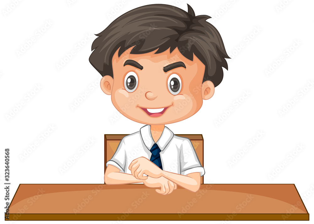 Boy in school uniform sitting at desk on white background Boy in school uniform sitting at desk on white background
