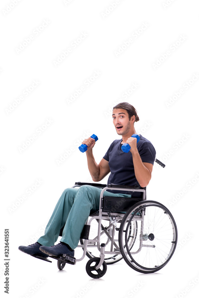 Young disabled man doing physical exercises isolated on white Young disabled man doing physical exercises isolated on white